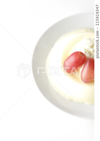 Panna cotta with cream and grapes photographed on a white background Panna cotta with cream and grapes photographed on a white background 115919347