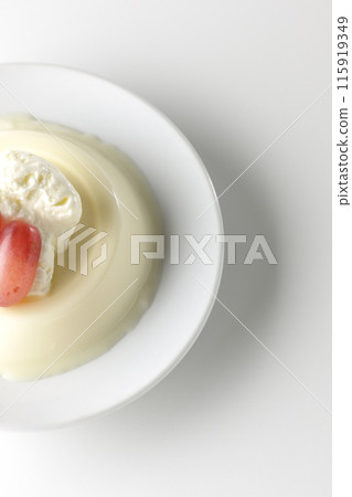 Panna cotta with cream and grapes photographed on a white background 115919349