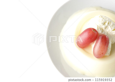 Panna cotta with cream and grapes photographed on a white background Panna cotta with cream and grapes photographed on a white background 115919352