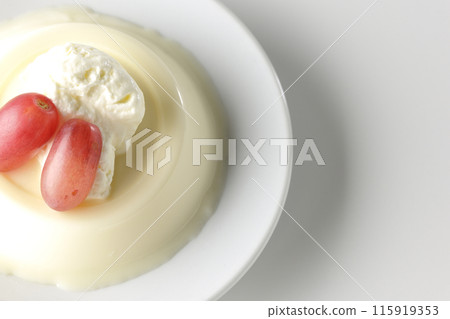 Panna cotta with cream and grapes photographed on a white background 115919353