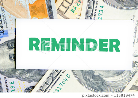 Life and business motivational inspirational concept. Reminder, text words on a white business card against a background of dollar bills Life and business motivational inspirational concept. Reminder, text words on a white business card against a background of dollar bills 115919474