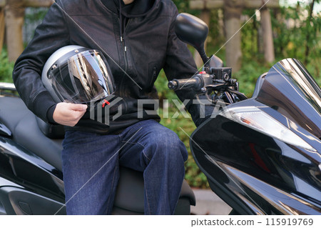 Hand of a man with a helmet Hand of a man with a helmet 115919769