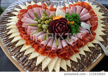 Classic Croatian starter plate with Fine Croatian ham, sliced salami and cheese 115919883