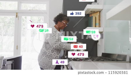 Image of social media text and icons over senior african american woman at home Image of social media text and icons over senior african american woman at home 115920381