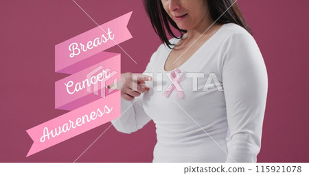 Breast cancer awareness text banner against mid section of woman wearing pink ribbon on her chest Breast cancer awareness text banner against mid section of woman wearing pink ribbon on her chest 115921078