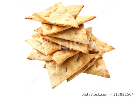 A pile of golden, crispy triangle-shaped Pita Chips isolated on transparent, ideal for snacking or appetizers 115921504