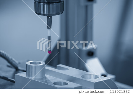 The  CMM probe measuring the  aluminum automotive parts. 115921882