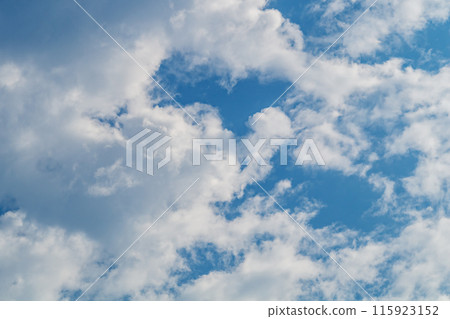 White clouds almost completely covered the blue of the clear sky. Background for art blanks, wallpaper for the computer desktop, screensaver. White clouds almost completely covered the blue of the clear sky. Background for art blanks, wallpaper for the computer desktop, screensaver. 115923152