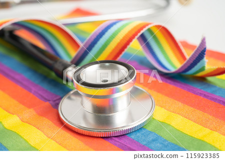 Stethoscope on rainbow flag background, symbol of LGBT pride month celebrate annual in June social, symbol of gay, lesbian, bisexual, transgender, human rights and peace. 115923385