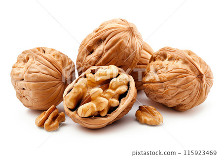 Close-up of shelled and unshelled Walnut nuts isolated on a white background, showcasing their texture 115923469
