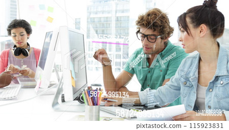 Image of numbers and lines over caucasian female and male coworkers in office Image of numbers and lines over caucasian female and male coworkers in office 115923831