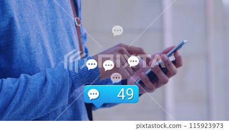 Image of social media reaction over hands of caucasian man using smartphone Image of social media reaction over hands of caucasian man using smartphone 115923973