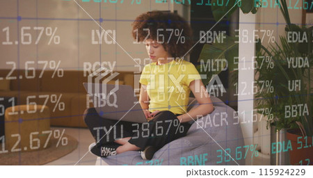 Image of data processing over african american businesswoman using laptop Image of data processing over african american businesswoman using laptop 115924229