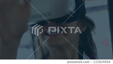Image of multicolored geometric shapes over smiling caucasian businesswoman using vr headset Image of multicolored geometric shapes over smiling caucasian businesswoman using vr headset 115924958