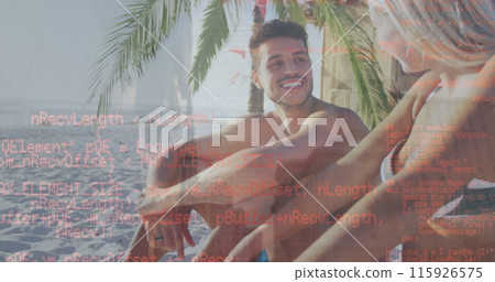 A caucasian couple is sitting by a palm tree and enjoying their time at the beach on a sunny day A caucasian couple is sitting by a palm tree and enjoying their time at the beach on a sunny day 115926575