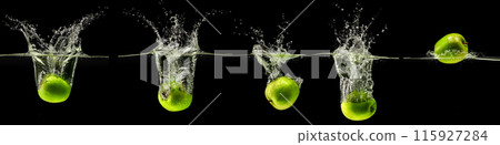 Green apple falling in water on black background 115927284