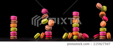 Heap of french colorful macaroons on wooden table isolated on black 115927307