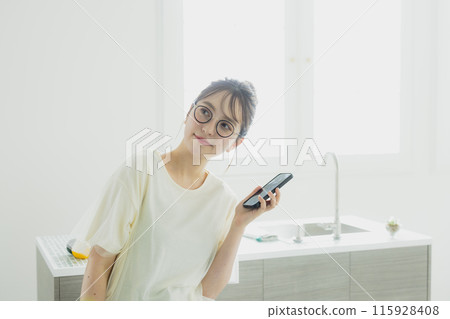 Woman in the kitchen 115928408