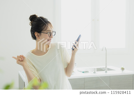 Woman in the kitchen 115928411
