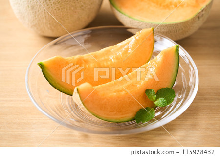 Sliced red flesh melon: Asahi melon from Hokkaido Sliced red flesh melon: Asahi melon from Hokkaido 115928432