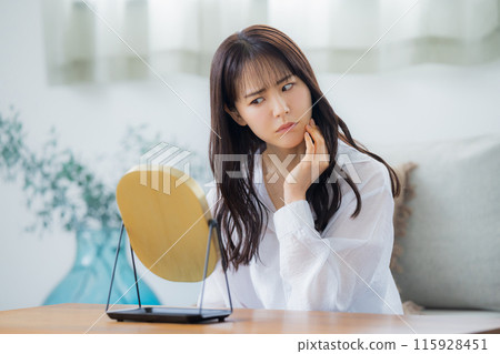 Women suffering from skin trouble Women suffering from skin trouble 115928451