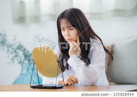 Women suffering from skin trouble Women suffering from skin trouble 115928454