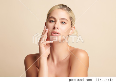 Beautiful young woman with clean fresh skin on beige background, Face care, Facial treatment, Cosmetology, beauty and spa, women portrait. 115928518