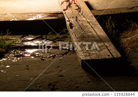 Blood drips on a wooden cross 115928844