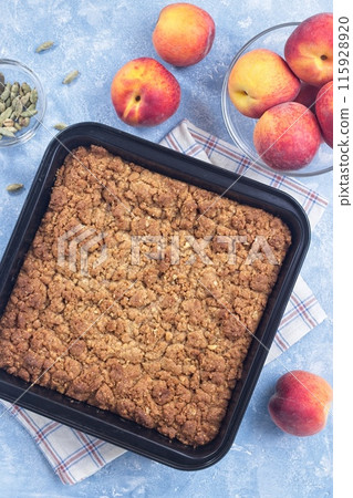 Delicious Peach Crisp or cobbler with brown sugar and oat streusel, vertical, top view Delicious Peach Crisp or cobbler with brown sugar and oat streusel, vertical, top view 115928920