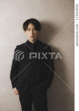 Man in black suit 115929082