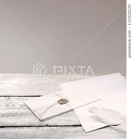 Envelope and paper with pen on the table Envelope and paper with pen on the table 115929220