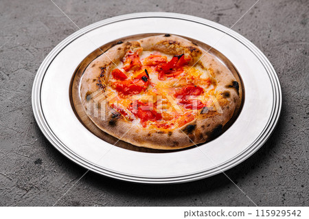Freshly baked margherita pizza on plate Freshly baked margherita pizza on plate 115929542