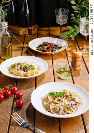 Gourmet italian pasta dishes on rustic wooden table Gourmet italian pasta dishes on rustic wooden table 115929677