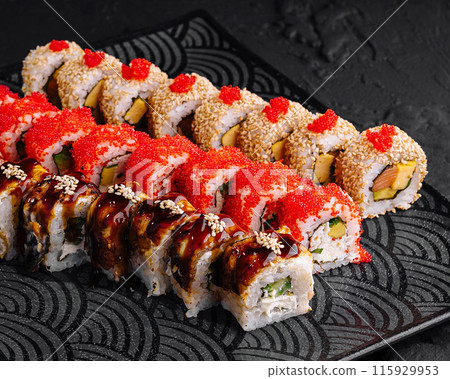 Gourmet sushi platter on modern dark plate Gourmet sushi platter on modern dark plate 115929953