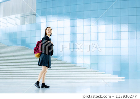 Schoolgirl in uniform 115930277