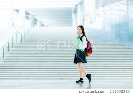 Schoolgirl in uniform 115930283