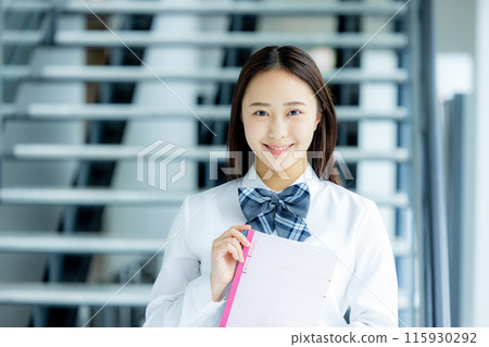 High school girl with notebook High school girl with notebook 115930292