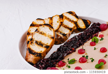 Gourmet chicken liver pate with berry compote and grilled bread 115930419