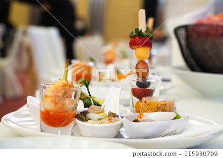 Buffet meals in luxury hotels often include a variety of food options from all over the world.    115930709