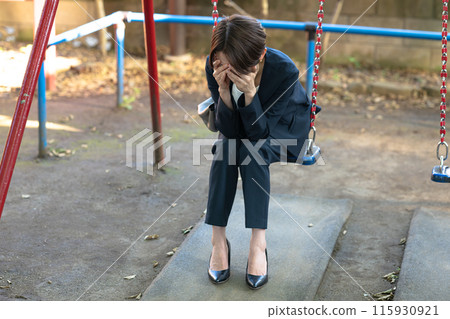 Woman thinking in the park 115930921