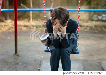 Woman thinking in the park 115930925