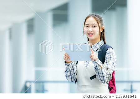 A woman with a tablet 115931641