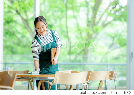 A woman working in a cafe A woman working in a cafe 115931670