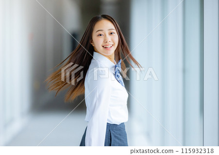High school girl in a shirt looking back 115932318