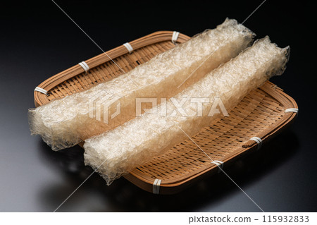 Natural cubes of agar on a bamboo colander on a black background Natural cubes of agar on a bamboo colander on a black background 115932833