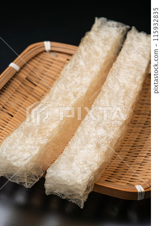 Natural cubes of agar on a bamboo colander on a black background Natural cubes of agar on a bamboo colander on a black background 115932835