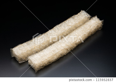 Domestically produced natural cubes of agar on a black background 115932837