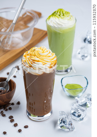 Caramel frappe and matcha frappe on white table Caramel frappe and matcha frappe on white table 115932870