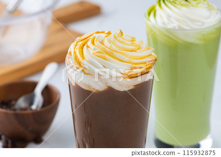 Caramel frappe and matcha frappe on white table Caramel frappe and matcha frappe on white table 115932875