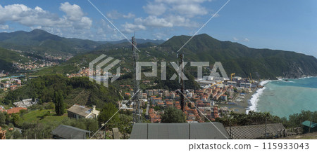 Panoramic aerial view on Riva Trigoso village from Punta Manara, sand beach, houses, shipyard and at sunny autumn day. Sestri Levante, Liguria, Italy 115933043